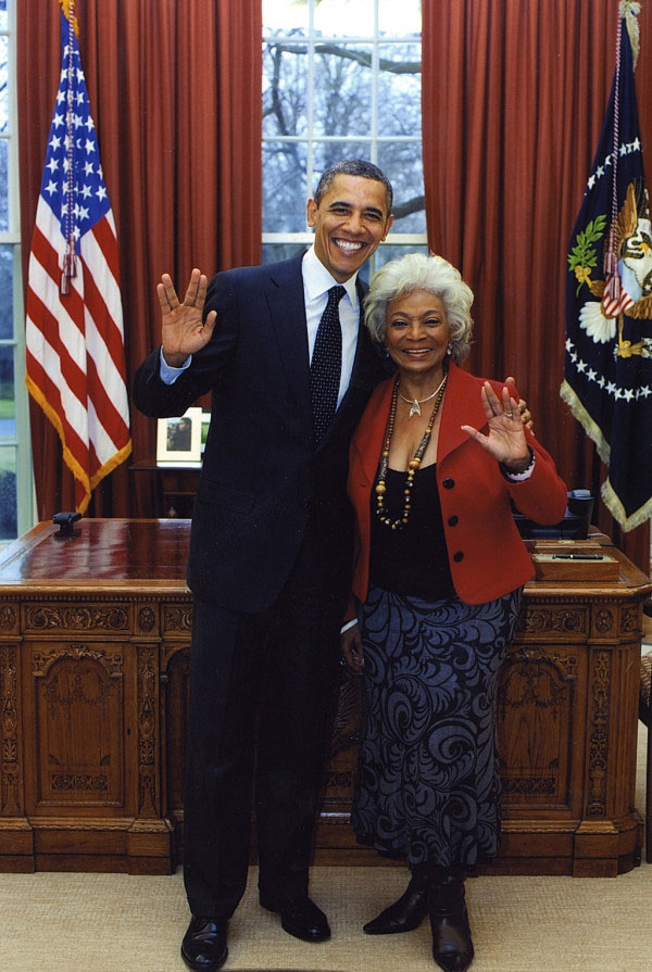 President Obama hugging Uhura and giving a Vulcan salute